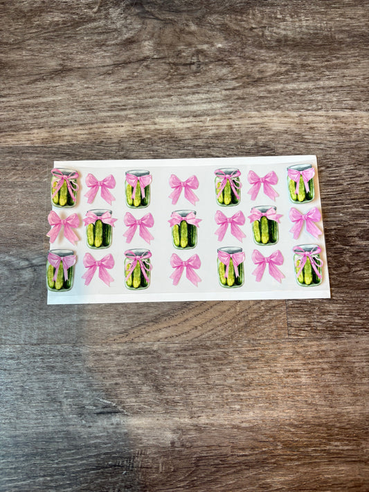 56a: Pickles with Bows